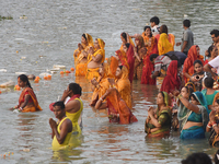 Hindu women devotees perform rituals in a water body in the river Ganga during the Hindu festival Chhath in Kolkata, India, on November 7, 2...