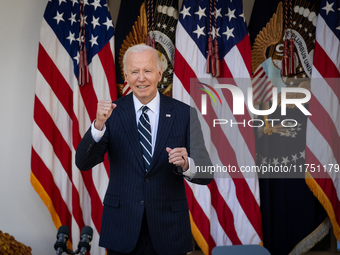 President Joe Biden pumps his fist after addressing senior staff and the nation on the results of the 2024 presidential election in the Whit...