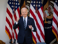 President Joe Biden pumps his fist after addressing senior staff and the nation on the results of the 2024 presidential election in the Whit...