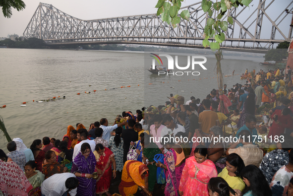 A Hindu devotee offers prayers to the sun god during The Chhath Festival at the Ganga ghat in Kolkata, India, on November 7, 2024. 