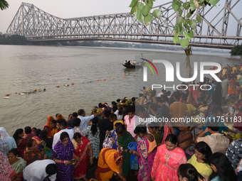 A Hindu devotee offers prayers to the sun god during The Chhath Festival at the Ganga ghat in Kolkata, India, on November 7, 2024. (