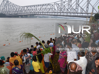 A Hindu devotee offers prayers to the sun god during The Chhath Festival at the Ganga ghat in Kolkata, India, on November 7, 2024. (