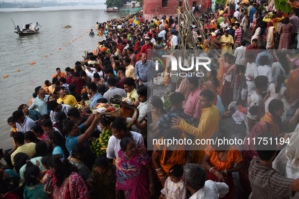 A Hindu devotee offers prayers to the sun god during The Chhath Festival at the Ganga ghat in Kolkata, India, on November 7, 2024. 