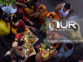 A Hindu devotee offers prayers to the sun god during The Chhath Festival at the Ganga ghat in Kolkata, India, on November 7, 2024. (