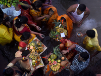 A Hindu devotee offers prayers to the sun god during The Chhath Festival at the Ganga ghat in Kolkata, India, on November 7, 2024. (