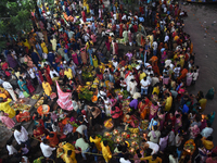 A Hindu devotee offers prayers to the sun god during The Chhath Festival at the Ganga ghat in Kolkata, India, on November 7, 2024. (