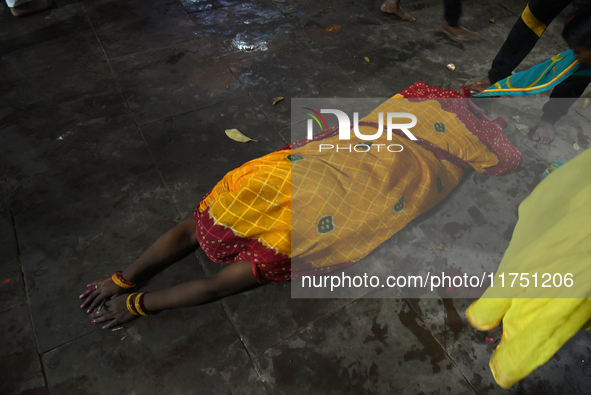 A Hindu devotee offers prayers to the sun god during The Chhath Festival at the Ganga ghat in Kolkata, India, on November 7, 2024. 