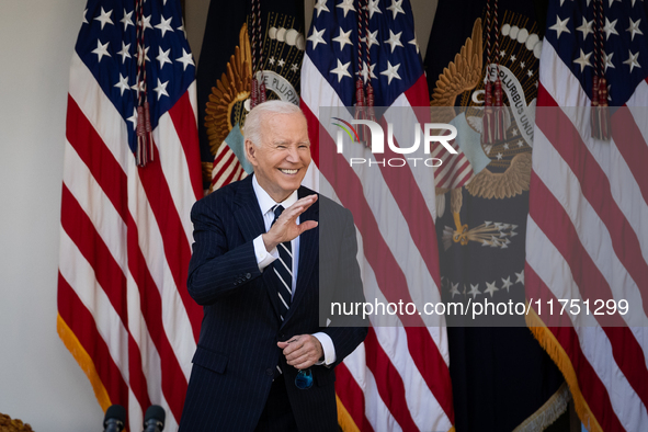 President Joe Biden waves to senior staff after addressing the nation on the results of the 2024 presidential election in the White House ro...