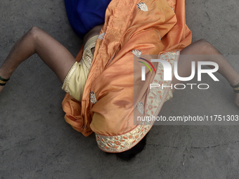 A Hindu devotee performs religious rituals near the Arabian Sea on the day of the Chhath Puja festival in Mumbai, India, on November 7, 2024...