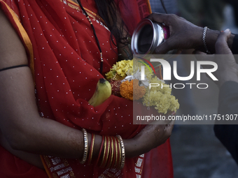 Hindu devotees perform religious rituals near the Arabian Sea on the day of the Chhath Puja festival in Mumbai, India, on November 7, 2024....