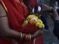 Hindu devotees perform religious rituals near the Arabian Sea on the day of the Chhath Puja festival in Mumbai, India, on November 7, 2024....