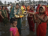 Hindu devotees perform religious rituals near the Arabian Sea on the day of the Chhath Puja festival in Mumbai, India, on November 7, 2024....