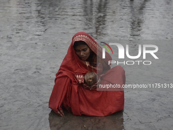 A Hindu devotee performs religious rituals near the Arabian Sea on the day of the Chhath Puja festival in Mumbai, India, on November 7, 2024...