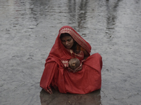 A Hindu devotee performs religious rituals near the Arabian Sea on the day of the Chhath Puja festival in Mumbai, India, on November 7, 2024...