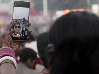 A Hindu devotee takes a selfie with her mobile phone near the Arabian Sea during the Chhath Puja festival in Mumbai, India, on November 7, 2...