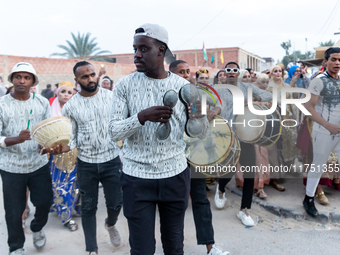 Bedouin wedding orchestra march on the street as wedding guests escort the bride to her husband's home in Tozeur, north west of Sahara, Tuni...