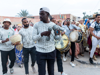 Bedouin wedding orchestra march on the street as wedding guests escort the bride to her husband's home in Tozeur, north west of Sahara, Tuni...