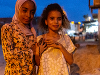 Bedouin girls pose to be photographed during wedding in Tozeur, north west of Sahara, Tunisia on October 28, 2024 (