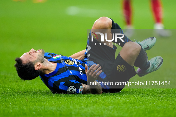 Hakan Calhanoglu of FC Internazionale lies down injured during the UEFA Champions League 2024/25 League Phase MD4 match between FC Internazi...