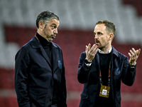 AFC Ajax Amsterdam assistant trainer Daniele Cavalletto and AFC Ajax Amsterdam physical trainer Callum Walsh are present during the match be...