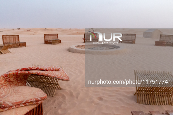 Tourist camp is seen on dunes of Eastern Sahara desert on a sunny day on October 30, 2024 near Douz, Tunisia. 