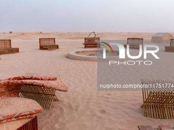 Tourist camp is seen on dunes of Eastern Sahara desert on a sunny day on October 30, 2024 near Douz, Tunisia. (