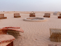 Tourist camp is seen on dunes of Eastern Sahara desert on a sunny day on October 30, 2024 near Douz, Tunisia. (