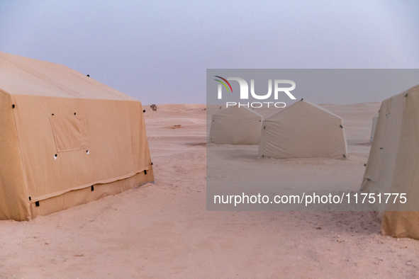 Tourist camp is seen on dunes of Eastern Sahara desert on a sunny day on October 30, 2024 near Douz, Tunisia. 