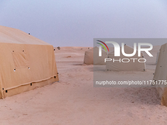 Tourist camp is seen on dunes of Eastern Sahara desert on a sunny day on October 30, 2024 near Douz, Tunisia. (