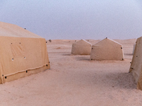 Tourist camp is seen on dunes of Eastern Sahara desert on a sunny day on October 30, 2024 near Douz, Tunisia. (