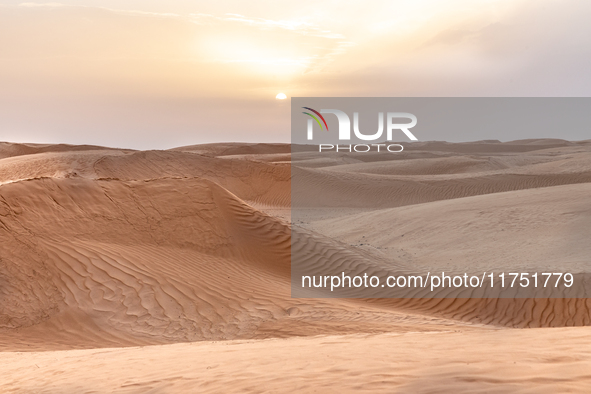 Sunset is seen over dunes of Eastern Sahara desert on on October 30, 2024 near Douz, Tunisia. 