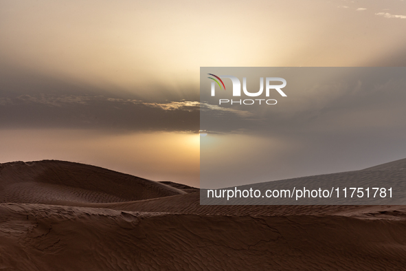 Sunset is seen over dunes of Eastern Sahara desert on on October 30, 2024 near Douz, Tunisia. 