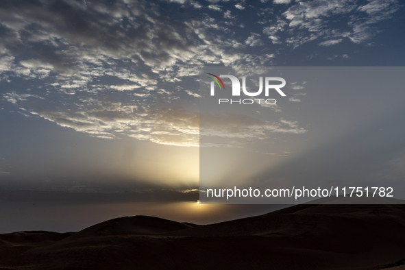 Sunset is seen over dunes of Eastern Sahara desert on on October 30, 2024 near Douz, Tunisia. 