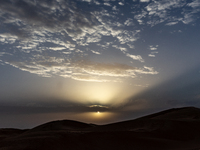 Sunset is seen over dunes of Eastern Sahara desert on on October 30, 2024 near Douz, Tunisia. (