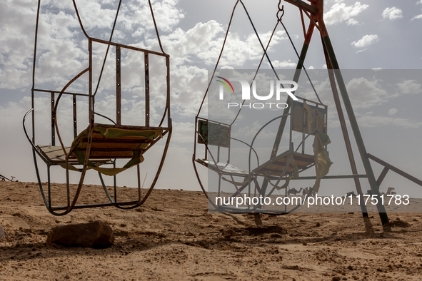 Old swings are seen on Eastern Sahara desert on a sunny day on October 30, 2024 near Douz, Tunisia. 