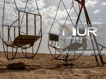 Old swings are seen on Eastern Sahara desert on a sunny day on October 30, 2024 near Douz, Tunisia. (