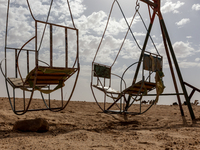 Old swings are seen on Eastern Sahara desert on a sunny day on October 30, 2024 near Douz, Tunisia. (