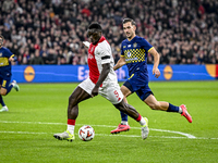 AFC Ajax Amsterdam forward Brian Brobbey and Maccabi Tel Aviv defender Nemanja Stojic play during the match between Ajax and Maccabi Tel Avi...