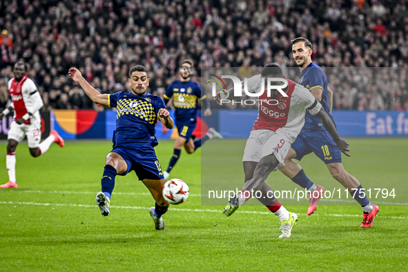 Maccabi Tel Aviv defender Raz Schlomo, AFC Ajax Amsterdam forward Brian Brobbey, and Maccabi Tel Aviv defender Nemanja Stojic participate in...