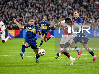 Maccabi Tel Aviv defender Raz Schlomo, AFC Ajax Amsterdam forward Brian Brobbey, and Maccabi Tel Aviv defender Nemanja Stojic participate in...