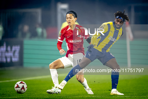 AZ Alkmaar defender Seiya Maikuma and Fenerbahce forward Allan Saint-Maximin play during the match between AZ and Fenerbahce at the AFAS Sta...