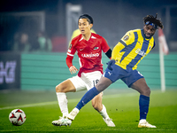 AZ Alkmaar defender Seiya Maikuma and Fenerbahce forward Allan Saint-Maximin play during the match between AZ and Fenerbahce at the AFAS Sta...