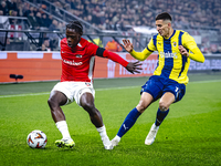 AZ Alkmaar forward Jayden Addai and Fenerbahce defender Mert Muldur play during the match AZ - Fenerbahce at the AFAS stadium for the UEFA E...