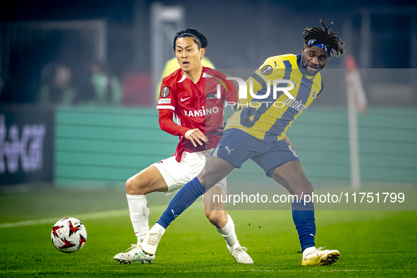 AZ Alkmaar defender Seiya Maikuma and Fenerbahce forward Allan Saint-Maximin play during the match between AZ and Fenerbahce at the AFAS Sta...