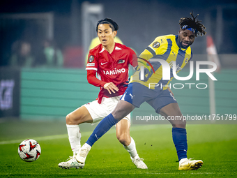 AZ Alkmaar defender Seiya Maikuma and Fenerbahce forward Allan Saint-Maximin play during the match between AZ and Fenerbahce at the AFAS Sta...