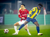 AZ Alkmaar defender Seiya Maikuma and Fenerbahce forward Allan Saint-Maximin play during the match between AZ and Fenerbahce at the AFAS Sta...