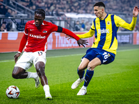 AZ Alkmaar forward Jayden Addai and Fenerbahce defender Mert Muldur play during the match AZ - Fenerbahce at the AFAS stadium for the UEFA E...