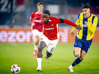 AZ Alkmaar forward Jayden Addai and Fenerbahce defender Mert Muldur play during the match AZ - Fenerbahce at the AFAS stadium for the UEFA E...