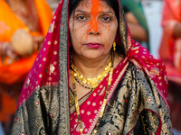 Hindu devotees perform rituals and offer prayers at sunset on the banks of the River Sabarmati during the Chhath Puja festival in Ahmedabad,...