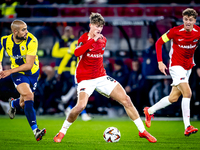 Fenerbahce midfielder Sofyan Amrabat and AZ Alkmaar midfielder Dave Kwakman play during the match between AZ and Fenerbahce at the AFAS Stad...